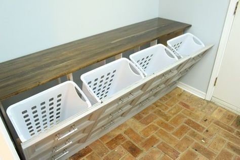 brown dresser repurposed into a laundry basket holder