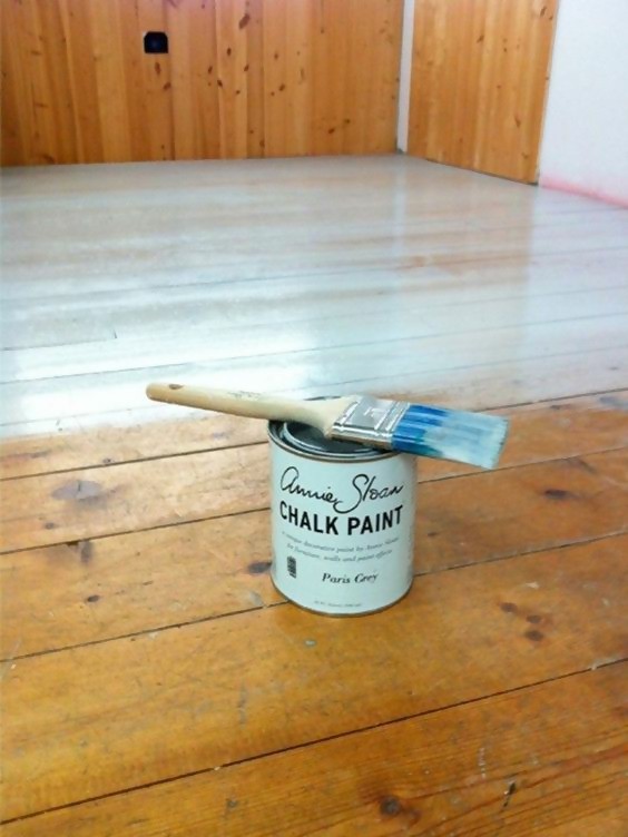 can of chalk paint with paint brush on top