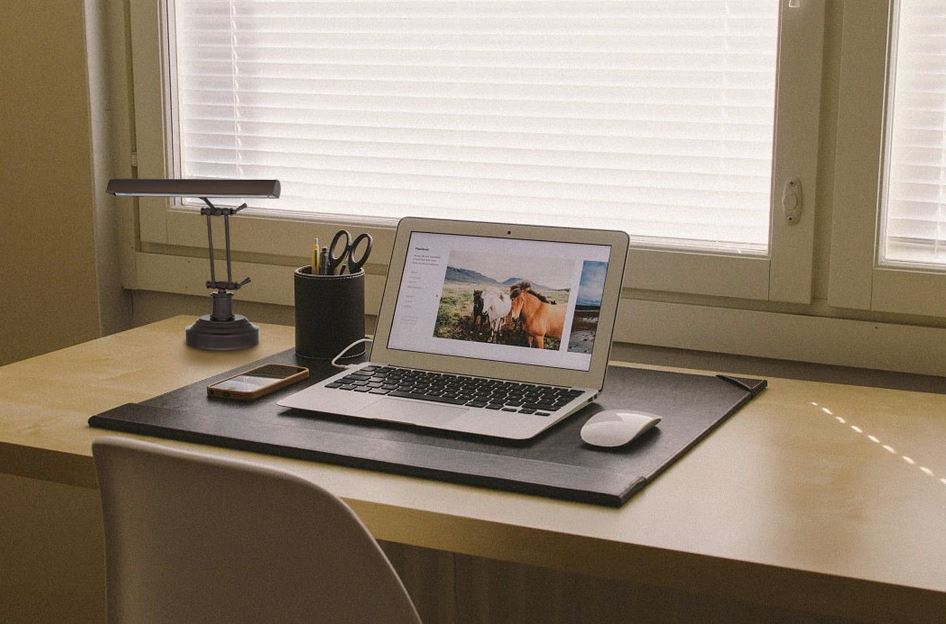 cocoweb desk lamp on desk with laptop on it