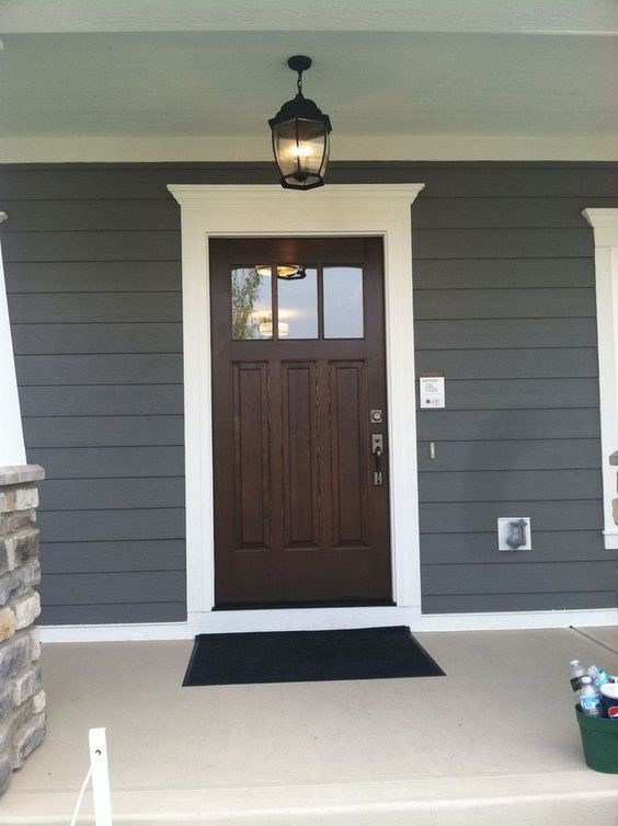 dark brown front door with white trimming
