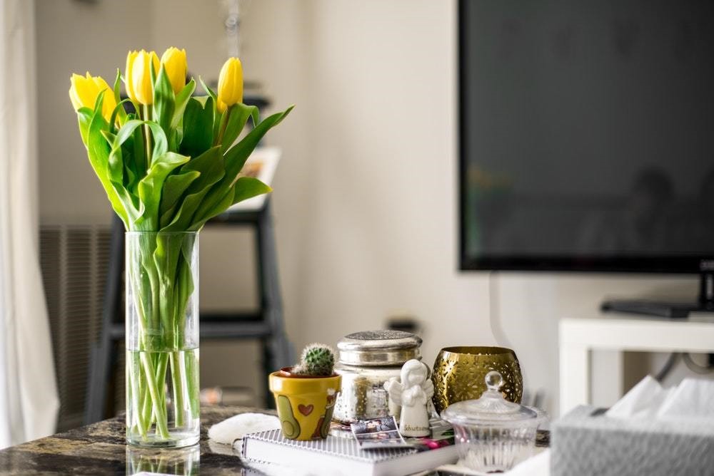 desk with vase of flowers