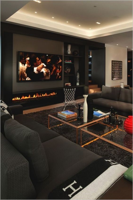 elegant modern living room with flat screen tv on wall and modern fireplace