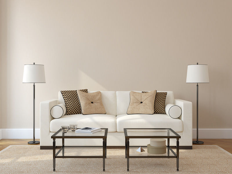 living room with white couch and two lamps