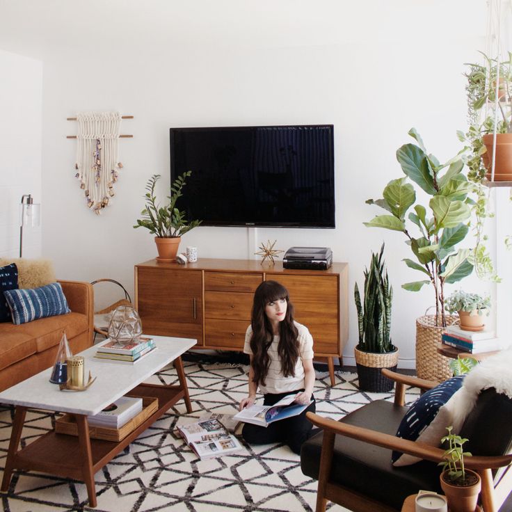 girl sitting on the floor of her living room