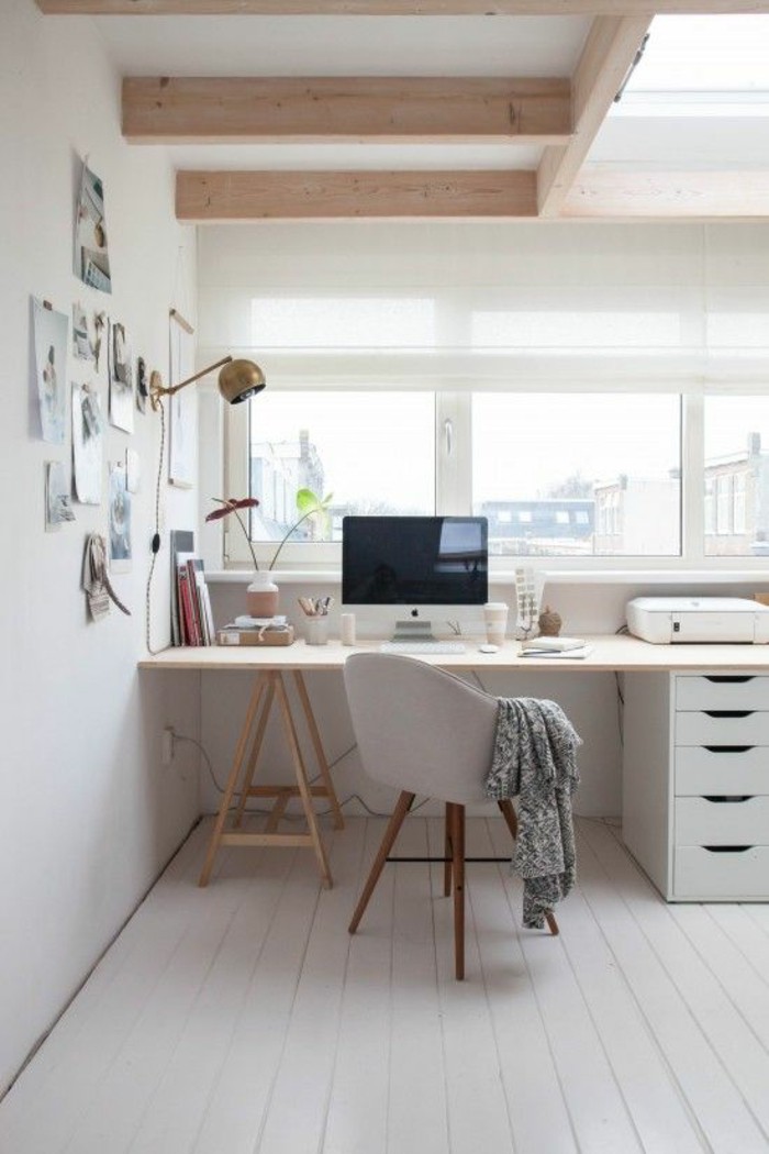 Office space with white walls and white desk with chair