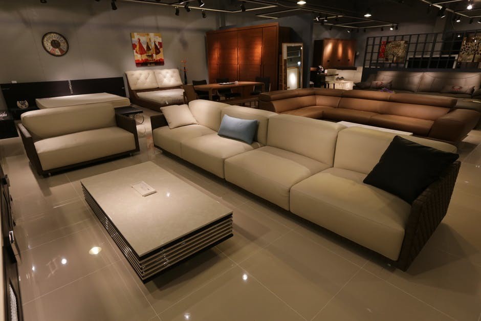 large family theatre room with several seating options and marble floor, large luxurious room