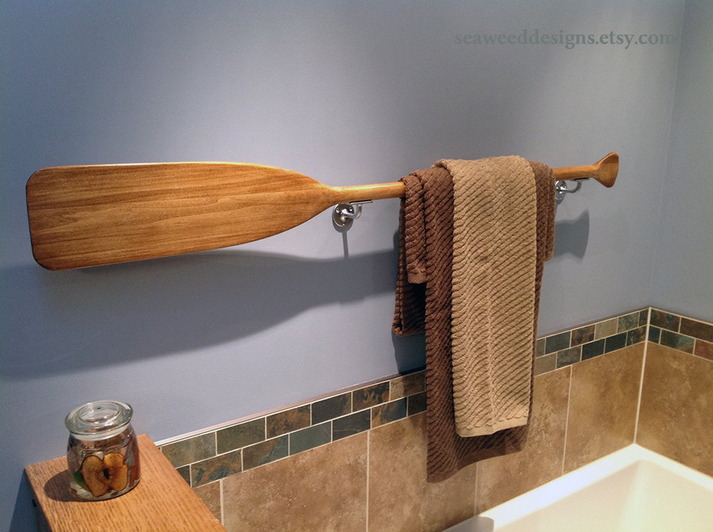 Paddle towel holder in bathroom