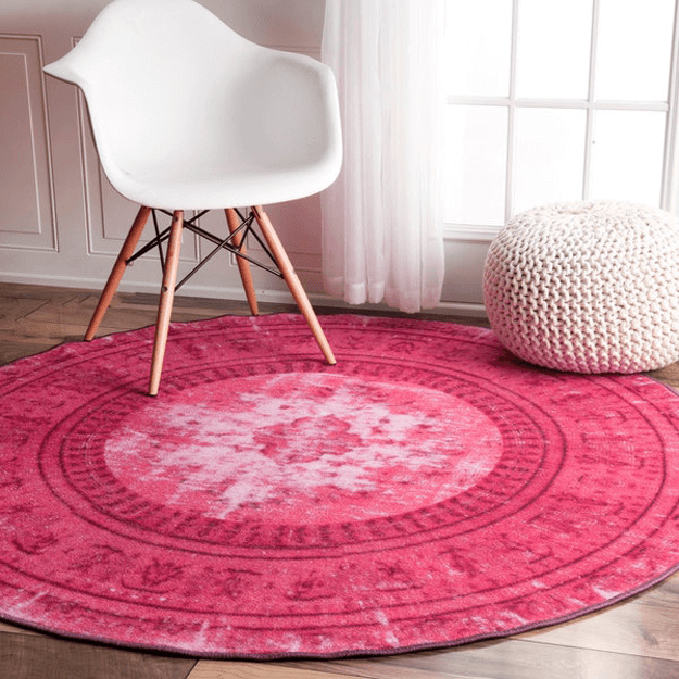 pink rug with white chair