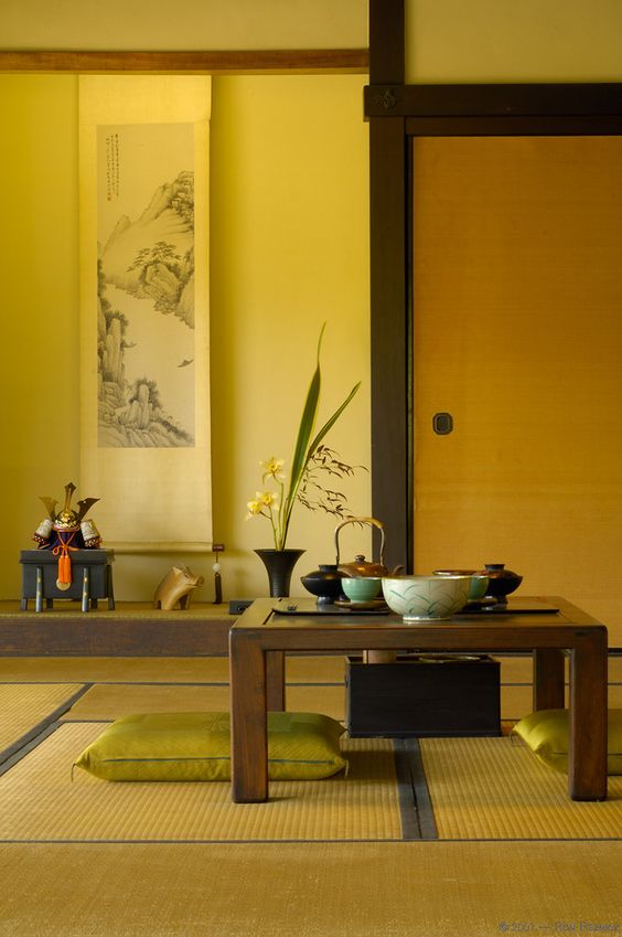 Japanese style yellow room with plant and coffee table