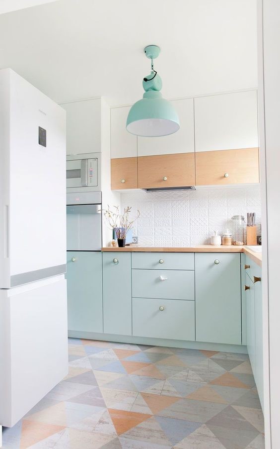 white kitchen with jade cabinets and jade hanging ceiling light