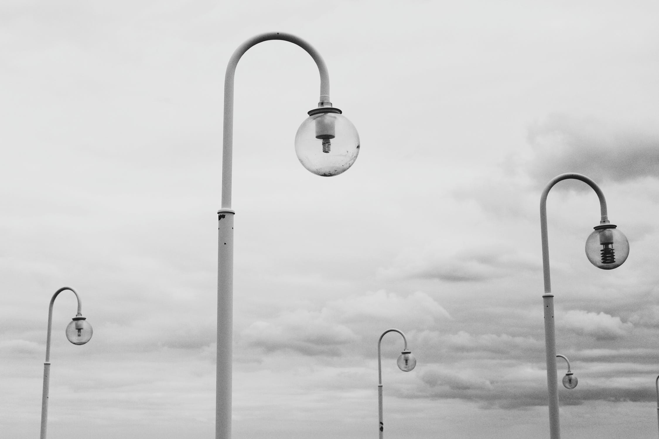 white post lamps on a gloomy day