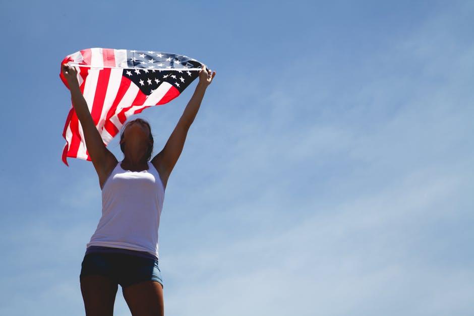 woman holding flag on a sunny day